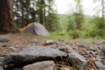 empty surface stone on the background of tent in the forest