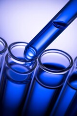 Over a blue background, test tubes contain blue liquid water samples and a pipette drops a sample into a test tube. Research in a lab using laboratory glassware.