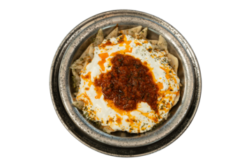 Presentation on metal plate, traditional kayseri manti, delicious manti with special sauce and yogurt. top view, white background.