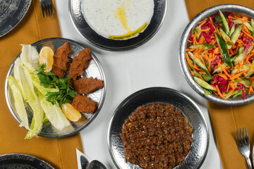 Top view, traditional Turkish cuisine and table setting, food service, appetizers and dishes.