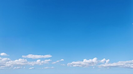Clear blue sky with white clouds