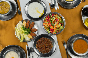 Top view, traditional Turkish cuisine and table setting, food service, appetizers and dishes.
