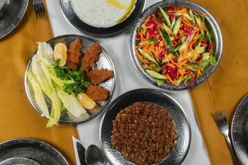 Top view, traditional Turkish cuisine and table setting, food service, appetizers and dishes.