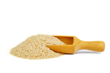 Amaranth flakes with wooden scoop isolated on white background