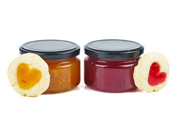 Two colored jam in glass jare with cookies shaped hearts
