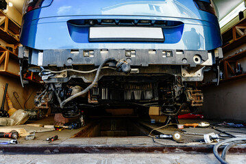 Disassembled car without bumper. Total repair after a hard accident, parts replacement.
