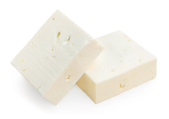Feta cheese pieces isolated.  Fresh Greek soft cheese on white background. Salad food ingredients. Top view, flat lay