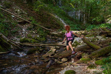 Fototapeta premium Woman hiker by the river