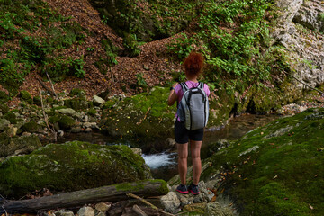 Woman hiker by the river