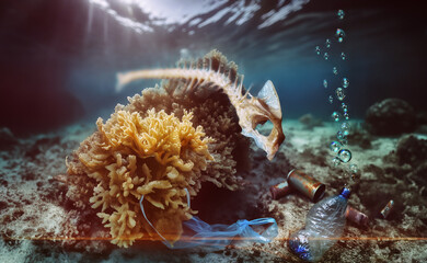 On the seabed, a sea bream skeleton drifts above a plastic bag entangled in seaweed, accompanied by a plastic bottle and rusty tin cans.