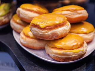 Delicious Yellow Cheese-Filled Donuts on Plate