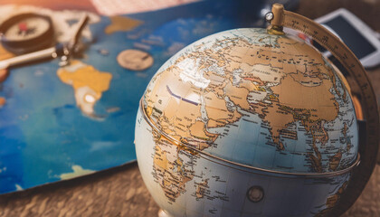 Close-Up of Global Maps and World Symbols