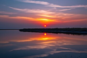 Obraz premium Serene Sunset Reflected Over Peaceful Water on Isolated Backdrop