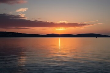 Obraz premium Breathtaking Sunset Reflection in Serenity of Calm Sea and Scenic Horizon