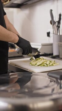 zucchini chopping on a cutting board in a cafe