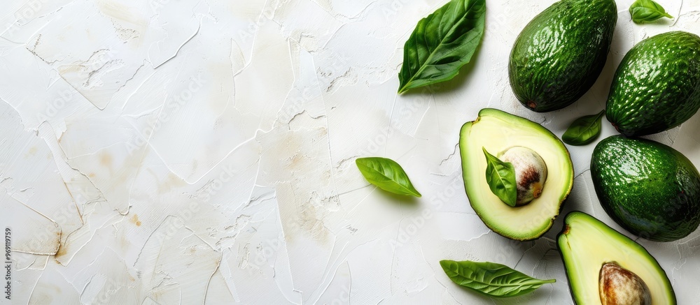 Poster Flat lay arrangement featuring ripe avocados against a white background with space for text Top view. with copy space image. Place for adding text or design