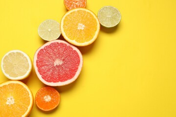 Tropical fruits on a colored background. Summer concept. Flat lay, top view, copy space