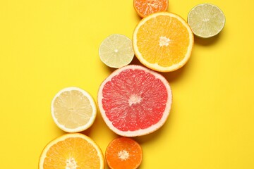Tropical fruits on a colored background. Summer concept. Flat lay, top view, copy space