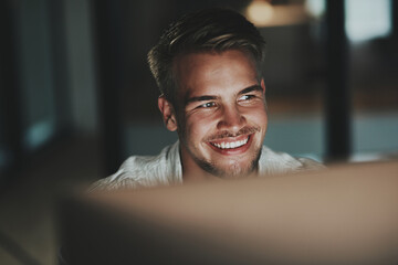 Night, computer and happy businessman in office for networking, technology or administration....