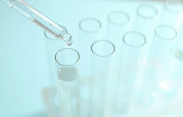 Laboratory test tubes on colored background
