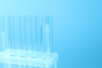 Laboratory test tubes on colored background