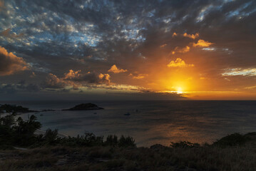Scenic moody sunset over Anchors Bay on Lizard Island in Queensland, Australia.