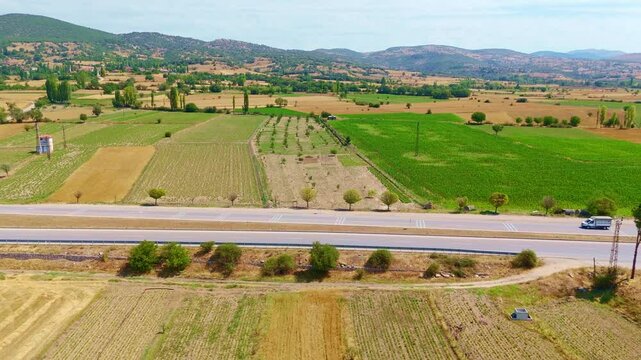 View a road with a car driving.