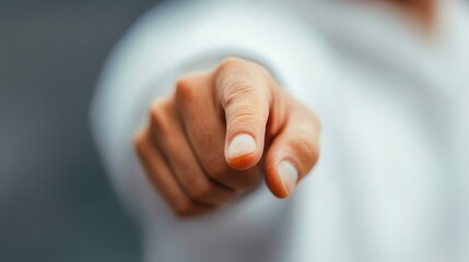 Outstretched hand with a pointing finger, symbolizing direction or choice ideal for motivational content, decision-making themes, or leadership messages,