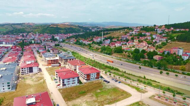 Aerial view a city with a highway.