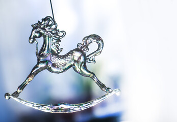 Transparent glass horse toy decor.