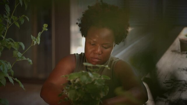 A woman diligently tending to her beautiful garden with great care and utmost dedication