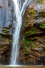 Obraz premium Waterfall over rocks in the rainforest in Minas Gerais