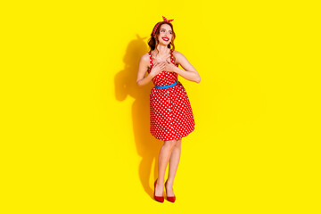 Photo of lovely pretty lady wear red stylish dress look empty space isolated on vibrant yellow color background