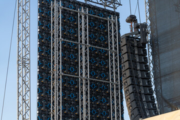 Large industrial concert screen on the backstage of a concert, showing the back side