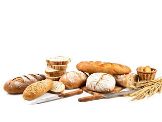Fototapeta premium Bread. Assortment of bread in on a white background. Baguette, multi-grain bread, drying, knife. Close-up. Isolated white.