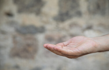 Young caucasian man showing empty hand.