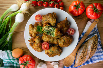 Spinach fritters, traditional Spanish tapa. Top view table.
