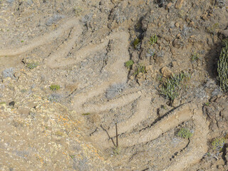 Aerial view of the trail through the mountains to Guigui beach, pristine black sand beach, Gran Canaria. Spain. Scenic trail