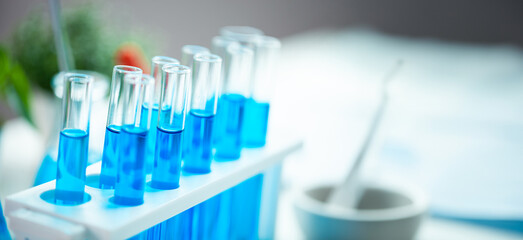 A collection of blue glass beakers and test tubes on a table