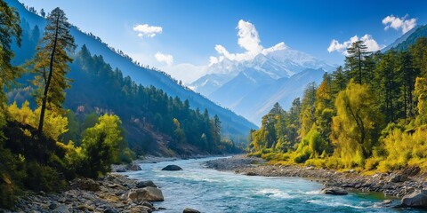 A beautiful mountain range with a river running through it. The sky is clear and blue, and the sun is shining brightly. The trees are lush and green, and the water is crystal clear