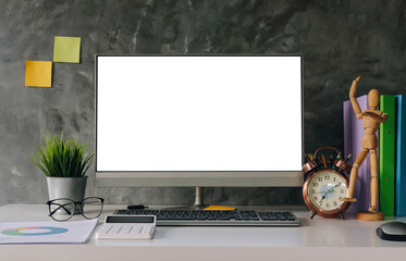 Blank screen Laptop computer and poster workspace background in modern office