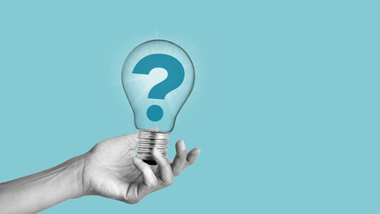 Creative idea or problem solving concept. The hand holding the lamp with question mark. Brainstorm...