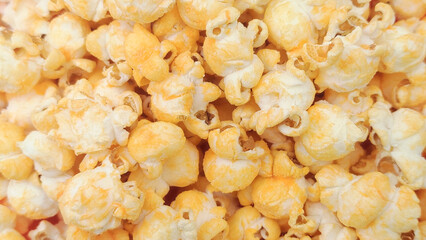 Background view of delicious, cheese-flavored popcorn.