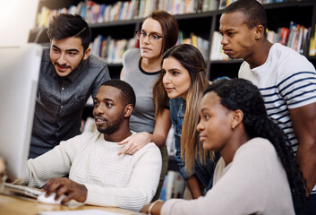 Students, computer and learning in library for university, study and education with exam collaboration. People, tech and diversity on college campus for research project, scholarship and math course