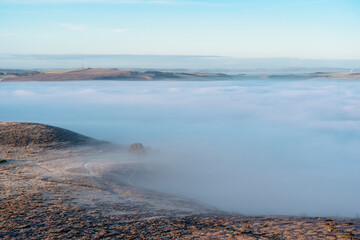 Fog Blankets Rolling Hills at Dawn, Creating a Serene Landscape of Mystery and Tranquility