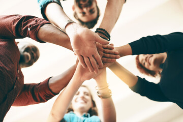 Below, people and hand stack in office for business, creativity and collaboration. Employees,...