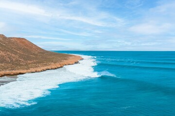 Stunning coastal scenery with clear blue ocean waves.