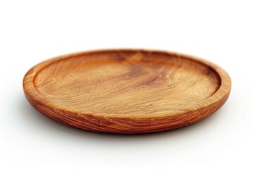 Obraz premium Close-up of a wooden plate on a clean white surface, perfect for use in food or interior design photography