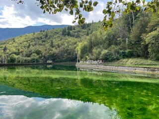 Fototapeta premium Small reservoir Plužna or Pluzensko lake, stream Gljun (Bovec, Slovenia) - Kleiner Stausee Pluzna, Bach Glijun (Bovec, Slowenien) - Akumulacijsko jezero Plužna or Plužensko jezero (Slovenija)