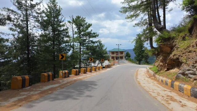 Paved narrow mountain road in Malam Jabba village on a sunny day in the Swat Valley, Pakistan